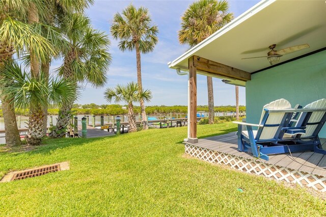 76 Heather Point Ct, New Smyrna Beach, FL 32169 - view of grassy yard featuring a wooden deck and a ceiling fan