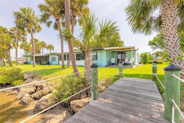 76 Heather Point Ct, New Smyrna Beach, FL 32169 - back of property with a lawn
