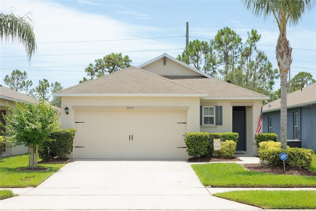2818 Taton Trce, New Smyrna Beach, FL 32168 - ranch-style house featuring stucco siding, a garage, and concrete driveway