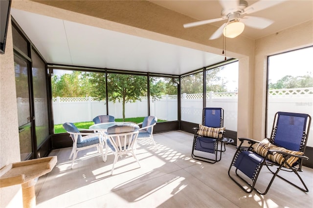 2818 Taton Trce, New Smyrna Beach, FL 32168 - sunroom with ceiling fan and outdoor dining area