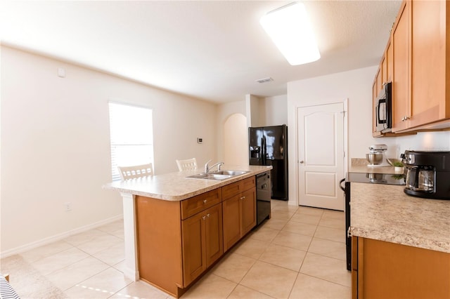2818 Taton Trce, New Smyrna Beach, FL 32168 - kitchen featuring black appliances, a sink, light countertops, and light tile patterned floors
