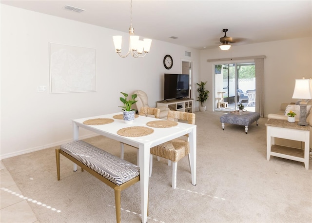 2818 Taton Trce, New Smyrna Beach, FL 32168 - carpeted dining area with a chandelier and a ceiling fan