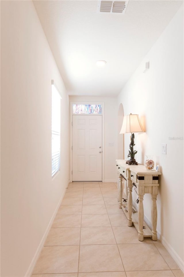 2818 Taton Trce, New Smyrna Beach, FL 32168 - entryway with light tile patterned flooring and baseboards