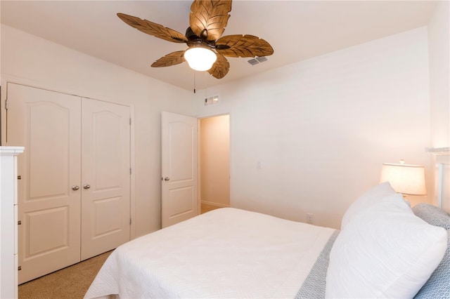 2818 Taton Trce, New Smyrna Beach, FL 32168 - bedroom featuring a closet, light colored carpet, and a ceiling fan