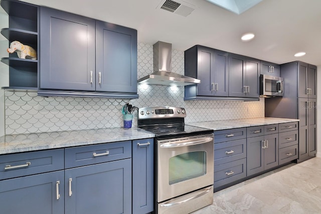 475 Spruceview Dr, Port Orange, FL 32127 - kitchen featuring stainless steel appliances, wall chimney range hood, tasteful backsplash, light stone countertops, and recessed lighting