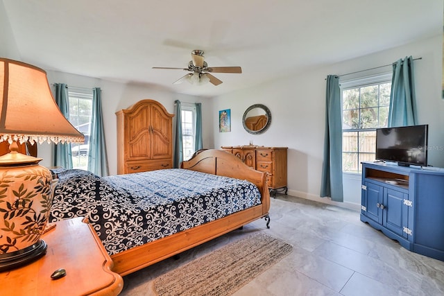 475 Spruceview Dr, Port Orange, FL 32127 - bedroom featuring multiple windows, a ceiling fan, and baseboards
