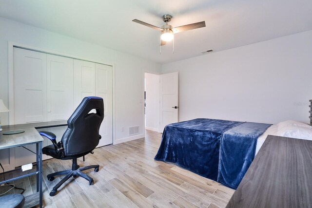 475 Spruceview Dr, Port Orange, FL 32127 - bedroom with light wood-style floors, a closet, an office area, baseboards, and ceiling fan
