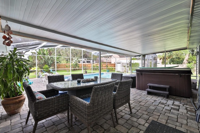 475 Spruceview Dr, Port Orange, FL 32127 - fenced backyard featuring a hot tub, a patio area, outdoor dining area, glass enclosure, and an outdoor pool