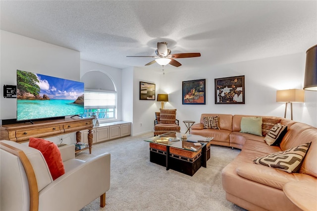 484 Sweet Bay Ave, New Smyrna Beach, FL 32168 - living area with ceiling fan, carpet floors, and a textured ceiling