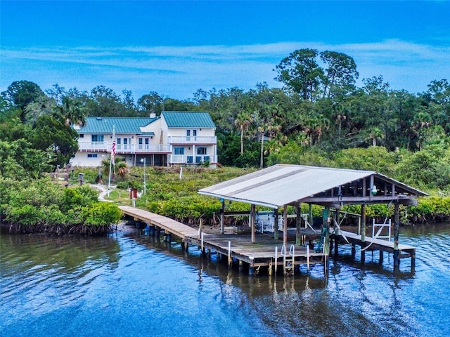 2950 Sunset Dr, New Smyrna Beach, FL 32168 - dock featuring a water view and boat lift