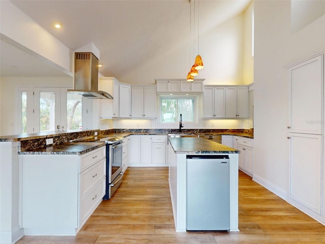 2950 Sunset Dr, New Smyrna Beach, FL 32168 - kitchen featuring island range hood, stainless steel range with electric cooktop, dark countertops, a sink, and high vaulted ceiling