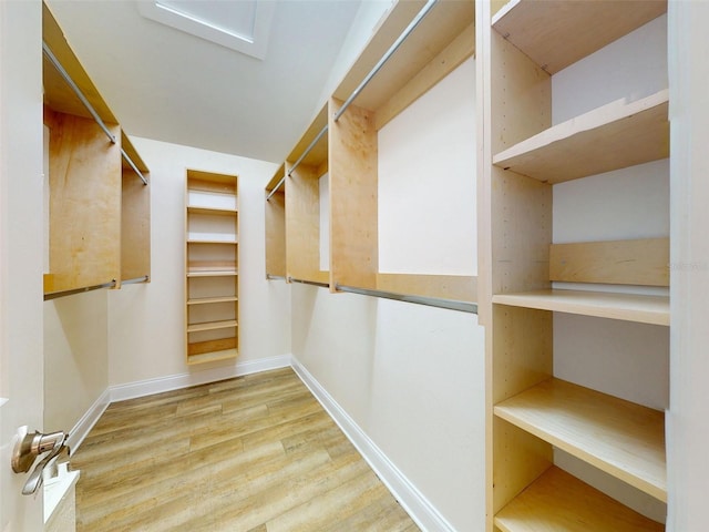 2950 Sunset Dr, New Smyrna Beach, FL 32168 - spacious closet featuring wood finished floors