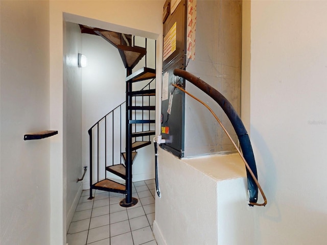 2950 Sunset Dr, New Smyrna Beach, FL 32168 - stairs featuring tile patterned floors and baseboards