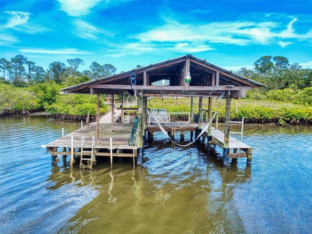 2950 Sunset Dr, New Smyrna Beach, FL 32168 - dock with boat lift and a water view