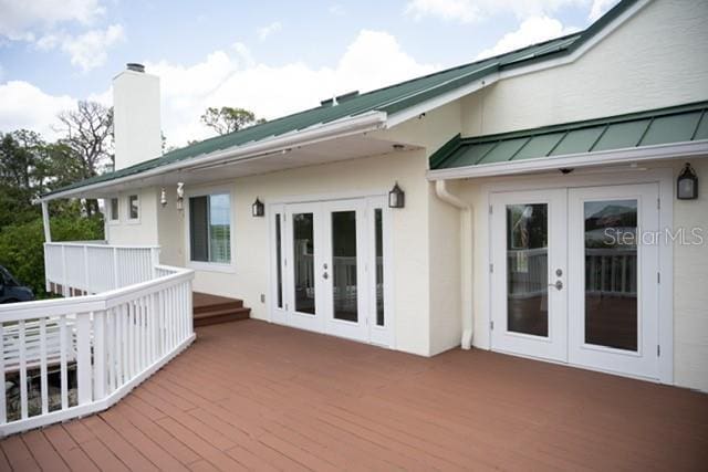 2950 Sunset Dr, New Smyrna Beach, FL 32168 - wooden terrace with french doors