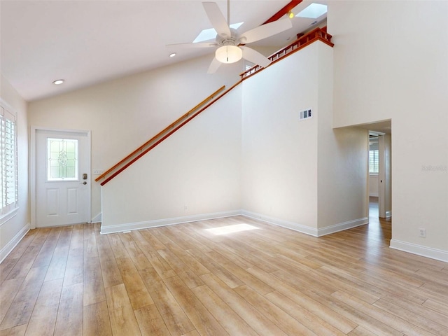 2950 Sunset Dr, New Smyrna Beach, FL 32168 - unfurnished living room with a ceiling fan, light wood-style floors, baseboards, and recessed lighting