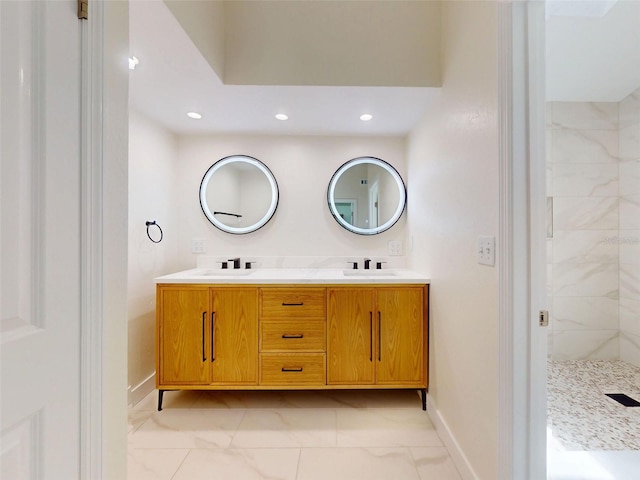2950 Sunset Dr, New Smyrna Beach, FL 32168 - bathroom with double vanity, baseboards, tiled shower, and recessed lighting