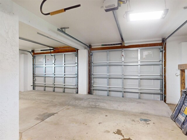 2950 Sunset Dr, New Smyrna Beach, FL 32168 - garage featuring a garage door opener
