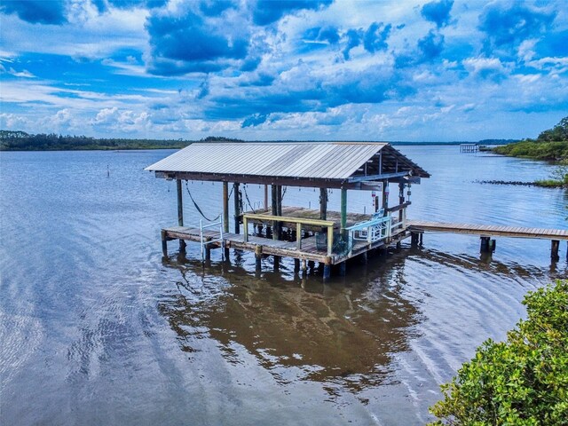 2950 Sunset Dr, New Smyrna Beach, FL 32168 - dock with boat lift and a water view