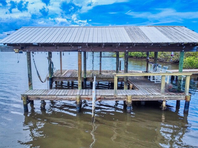 2950 Sunset Dr, New Smyrna Beach, FL 32168 - dock area with boat lift and a water view