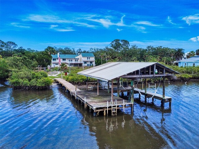 2950 Sunset Dr, New Smyrna Beach, FL 32168 - dock area with boat lift and a water view