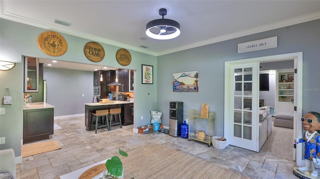 798 Fairway Dr, New Smyrna Beach, FL 32168 - interior space featuring stone tile floors, crown molding, french doors, and baseboards