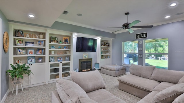798 Fairway Dr, New Smyrna Beach, FL 32168 - living room with a ceiling fan, ornamental molding, baseboards, a fireplace, and carpet floors