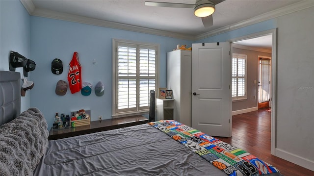 798 Fairway Dr, New Smyrna Beach, FL 32168 - bedroom with baseboards, wood finished floors, crown molding, and a ceiling fan