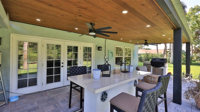798 Fairway Dr, New Smyrna Beach, FL 32168 - view of patio with french doors, a ceiling fan, and grilling area