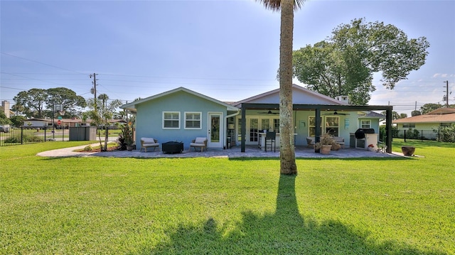 798 Fairway Dr, New Smyrna Beach, FL 32168 - back of house featuring a ceiling fan, a patio, stucco siding, and an outdoor hangout area