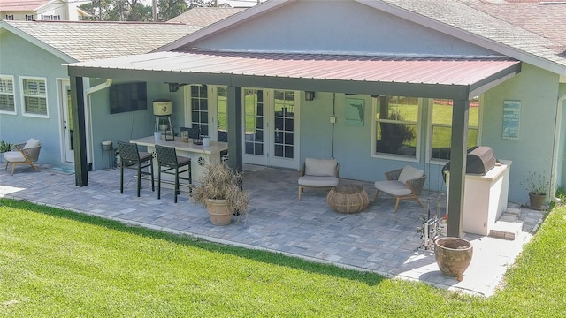 798 Fairway Dr, New Smyrna Beach, FL 32168 - rear view of house with a patio, stucco siding, metal roof, and a yard