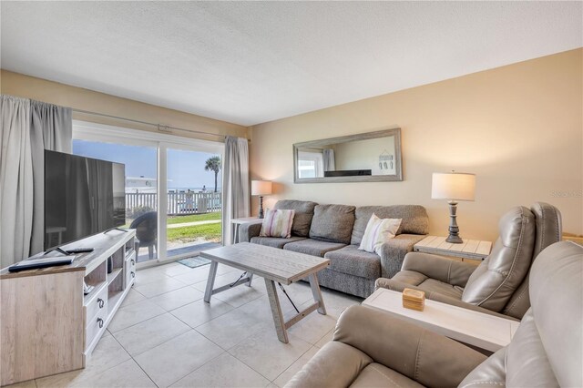 525 N Atlantic Ave Unit 39, New Smyrna Beach, FL 32169 - living area featuring light tile patterned floors