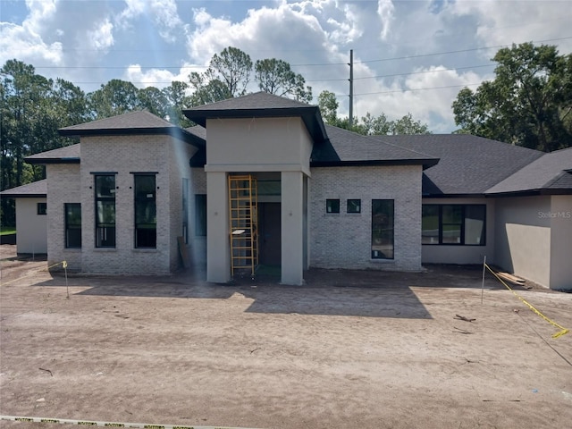 3106 Crossing Pine Ln, New Smyrna Beach, FL 32168 - view of front of house with brick siding and a shingled roof