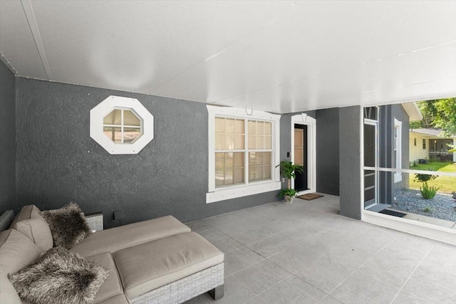 2325 Lime Tree Dr, Edgewater, FL 32141 - living area featuring tile patterned floors and a textured wall