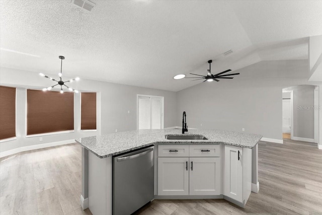 2325 Lime Tree Dr, Edgewater, FL 32141 - kitchen featuring stainless steel dishwasher, open floor plan, a sink, light wood finished floors, and a center island with sink