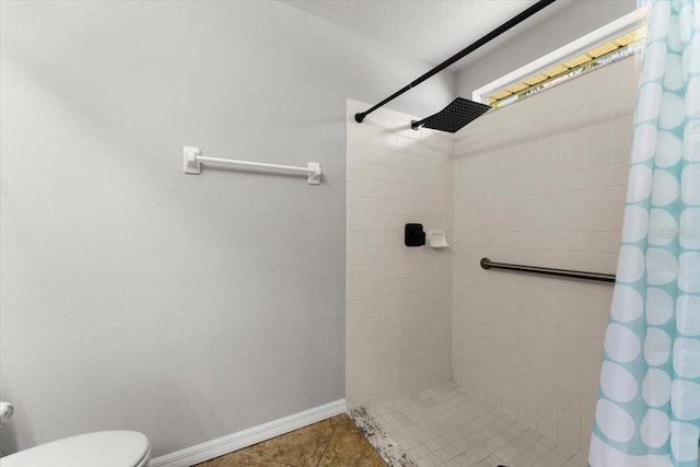 2325 Lime Tree Dr, Edgewater, FL 32141 - full bath featuring tiled shower, toilet, baseboards, and tile patterned flooring