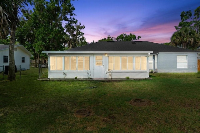2325 Lime Tree Dr, Edgewater, FL 32141 - back of property at dusk featuring a yard