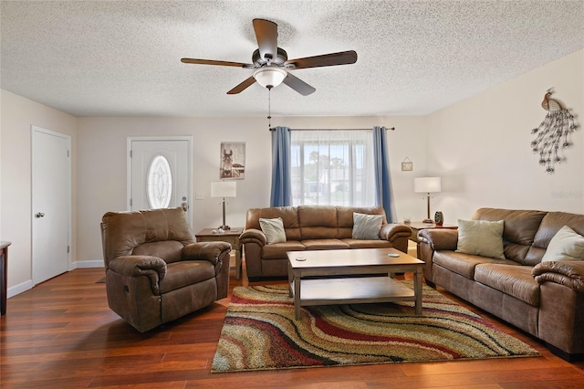 1723 Needle Palm Dr, Edgewater, FL 32132 - living area featuring a textured ceiling, a ceiling fan, dark wood-style flooring, and plenty of natural light