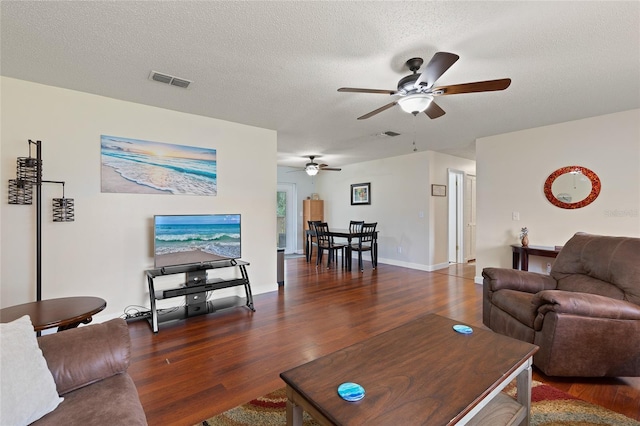 1723 Needle Palm Dr, Edgewater, FL 32132 - living area featuring ceiling fan, wood finished floors, and a textured ceiling