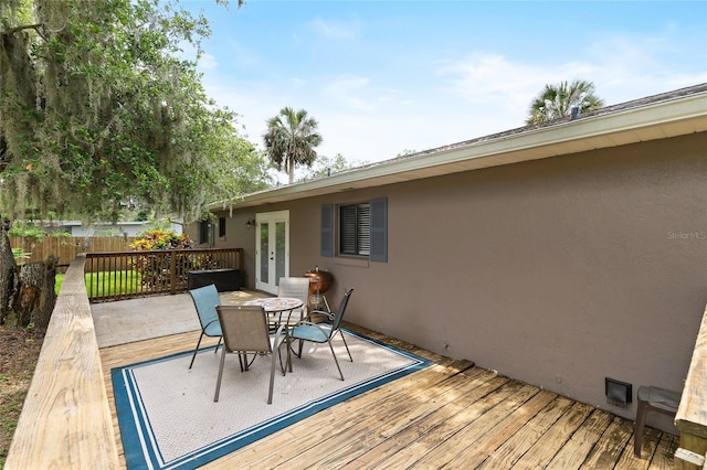 1723 Needle Palm Dr, Edgewater, FL 32132 - wooden deck featuring french doors and outdoor dining area