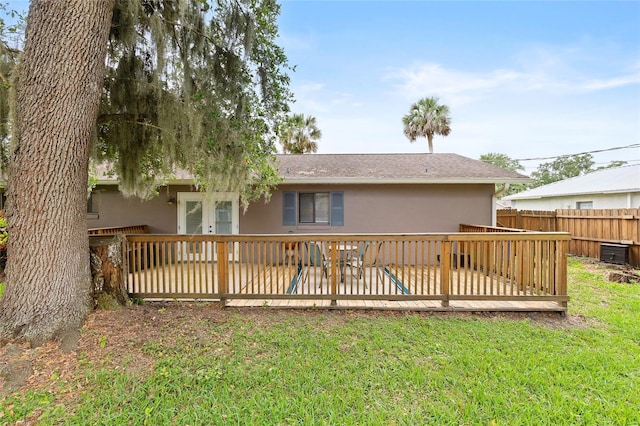 1723 Needle Palm Dr, Edgewater, FL 32132 - back of property featuring stucco siding and a wooden deck