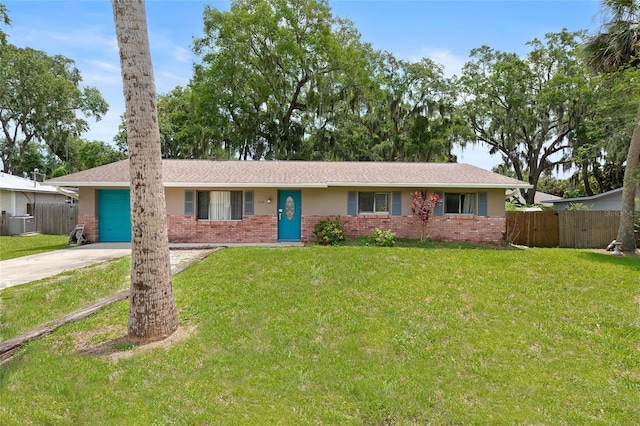 1723 Needle Palm Dr, Edgewater, FL 32132 - ranch-style home featuring brick siding, concrete driveway, and an attached garage