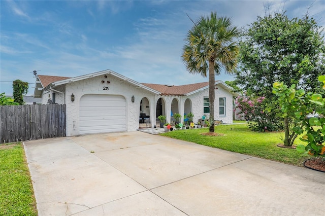 25 Dolphin Ave, Ormond Beach, FL 32176 - view of front of home with stucco siding, concrete driveway, an attached garage, and covered porch