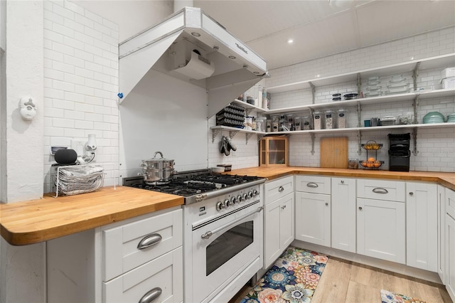 25 Dolphin Ave, Ormond Beach, FL 32176 - kitchen featuring butcher block countertops, white range with gas stovetop, tasteful backsplash, open shelves, and light wood-style floors