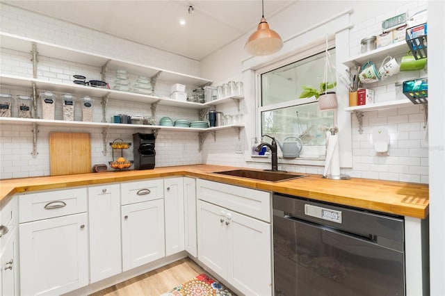 25 Dolphin Ave, Ormond Beach, FL 32176 - kitchen with butcher block counters, open shelves, and dishwasher