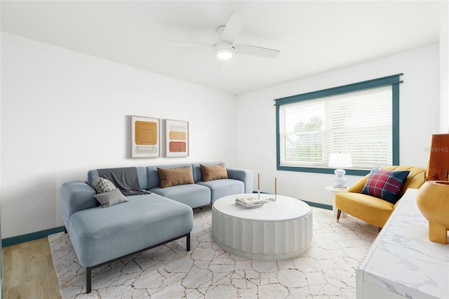25 Dolphin Ave, Ormond Beach, FL 32176 - living area featuring light wood-style floors, baseboards, and a ceiling fan