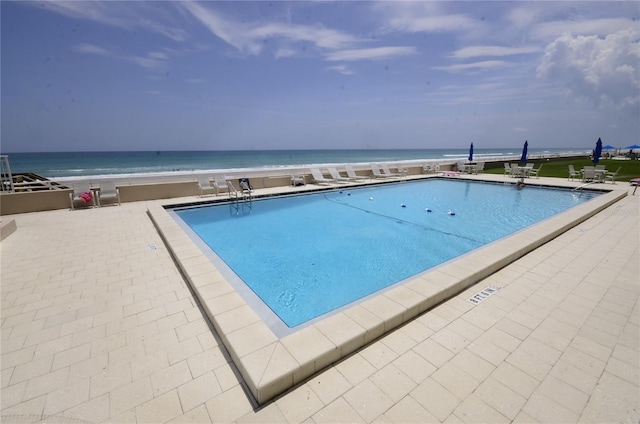 4435 S Atlantic Ave Unit 416, Port Orange, FL 32127 - community pool featuring a patio and a water view