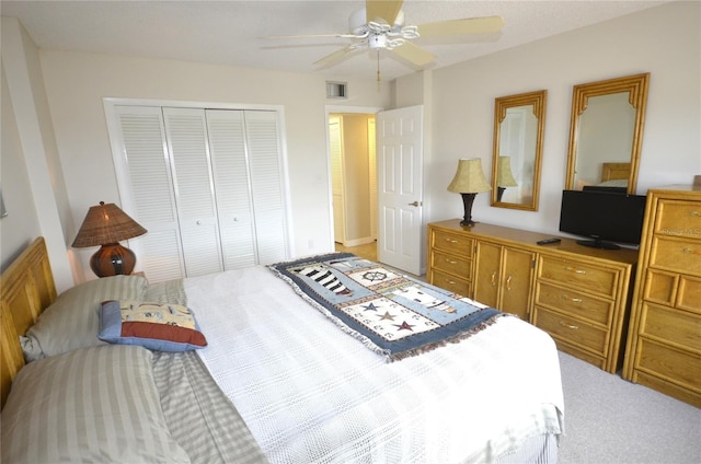 4435 S Atlantic Ave Unit 416, Port Orange, FL 32127 - carpeted bedroom featuring a closet and ceiling fan