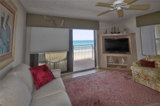 4435 S Atlantic Ave Unit 416, Port Orange, FL 32127 - living room featuring a textured ceiling and a ceiling fan