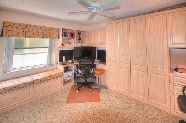 4435 S Atlantic Ave Unit 416, Port Orange, FL 32127 - office area with a ceiling fan, built in desk, and a textured ceiling